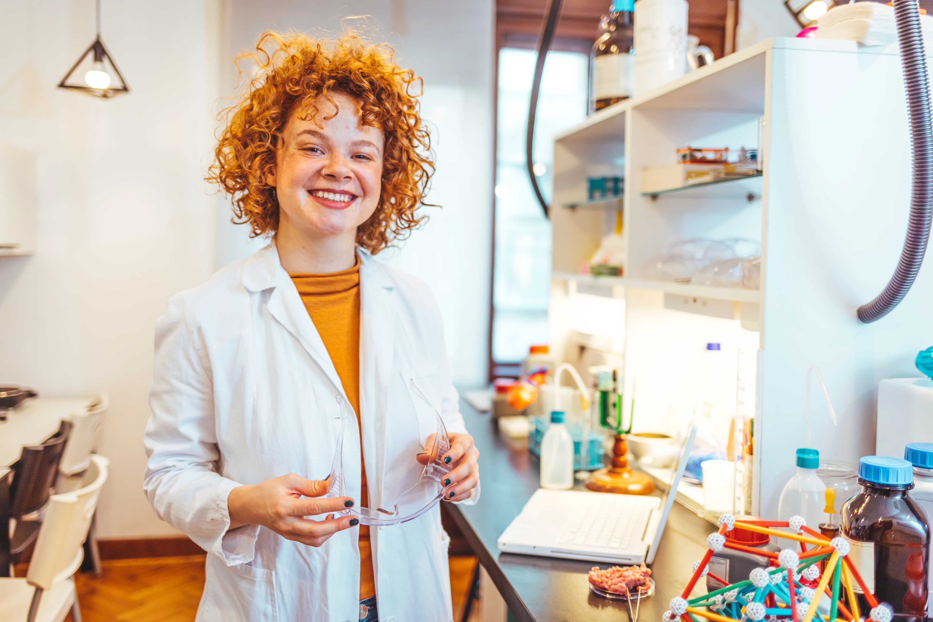 Scientist looking at test tube in laboratory